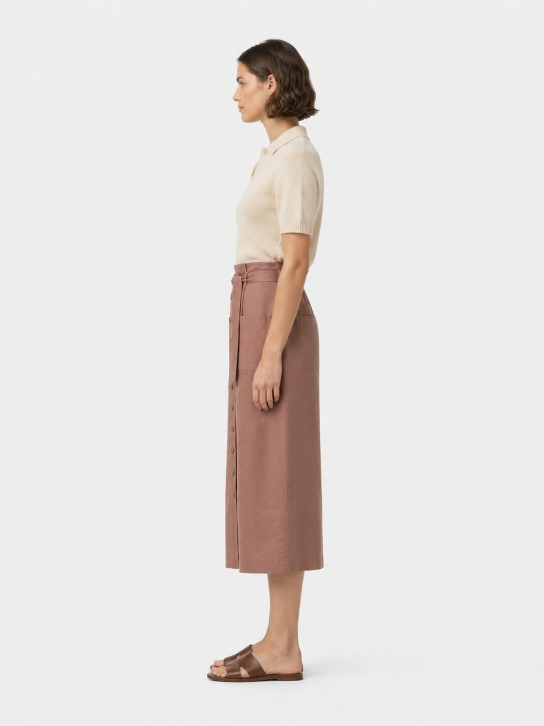 The Midi Skirt with a ribbed knit, studio side view