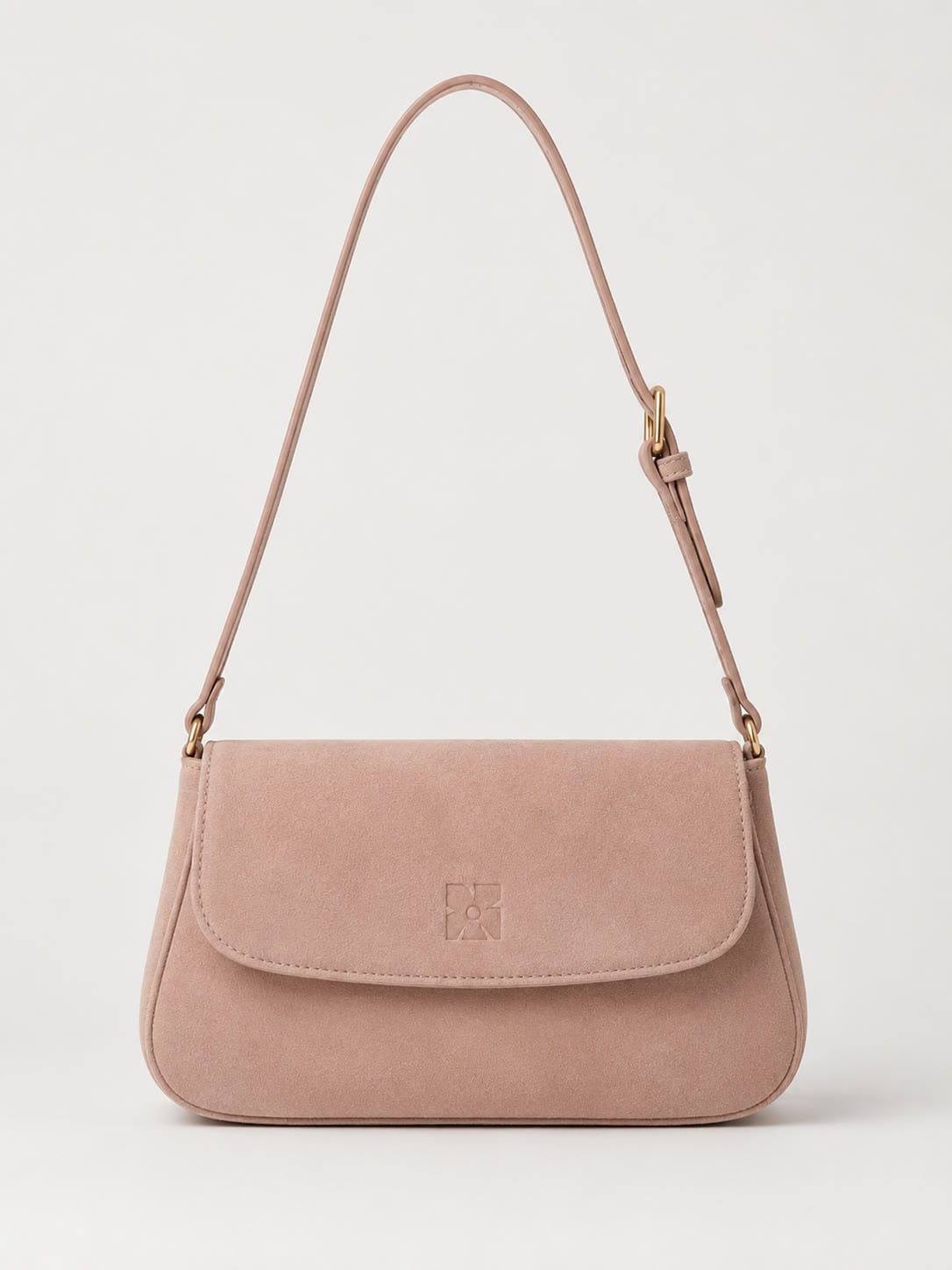 The Shoulder Bag in blush leather with a fold-over flap