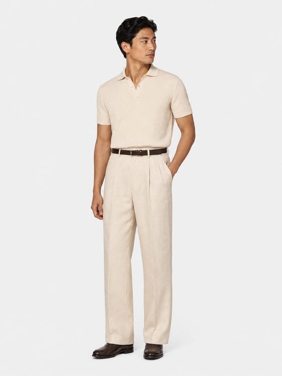 Look 01 — the ribbed polo in ecru with pleated trousers